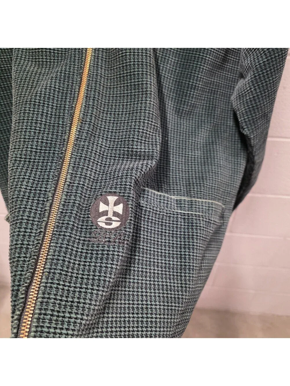 Schroff corduroy jacket features a distinctive green checkered pattern 25x34